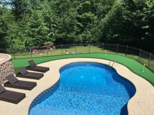 inground pool with putting green