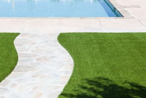 synthetic turf next to a pool